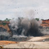 Clearing the site with dynamite to access the vein of coal in East Kalimantan, Indonesia.