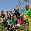 Omar al-Sharif, Motoharu Nochi, and a team of volunteers after a “growth monitoring” activity at the Marka baby forest in April 2022.