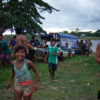 Residents of the Mura Indigenous village of Murutinga, in Brazil’s Amazonas state, take over a boat belonging to employees of the electricity company, who have come to cut off the community's energy supplies. Image by Ana Ionova for Mongabay.