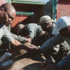 Team guiding a sedated rhino into a crate for translocation. Image by Casey Pratt / Love Africa Marketing.