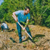 A man planting a tree.