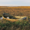 A boat in a salt marsh.