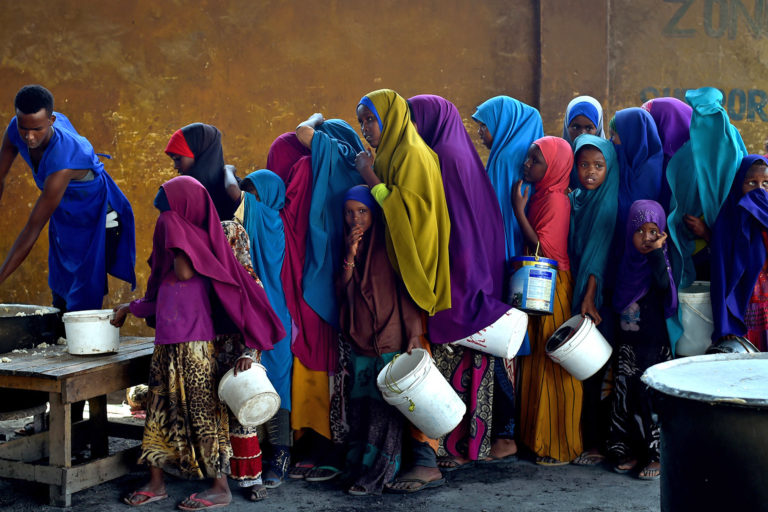 Young girls line up at a feeding centre in Mogadishu, Somalia