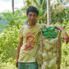 Posito Daom, a Pala'wan, pauses on his descent to the lowlands to sell chayote cultivated using the no-till method, a sustainable practice that avoids turning over and disturbing the soil, according to studies.