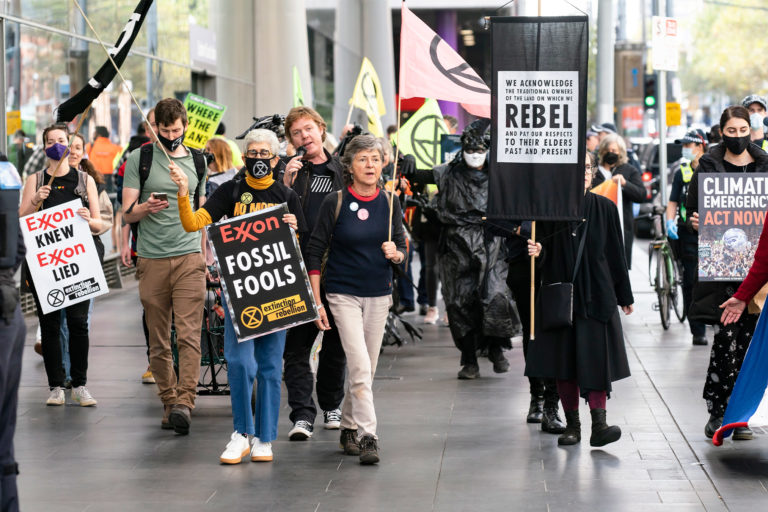 People protest against ExxonMobil in Melbourne, Australia.