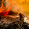 Firefighter fighting a battle against a veld-fire at Ashton Bay, Jeffreys Bay, Eastern Cape Province, Republic of South Africa in March 2017. Photo credit: Steven Terblanch