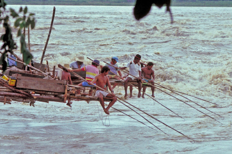 Fishermen fishing on the Madeira rapids.