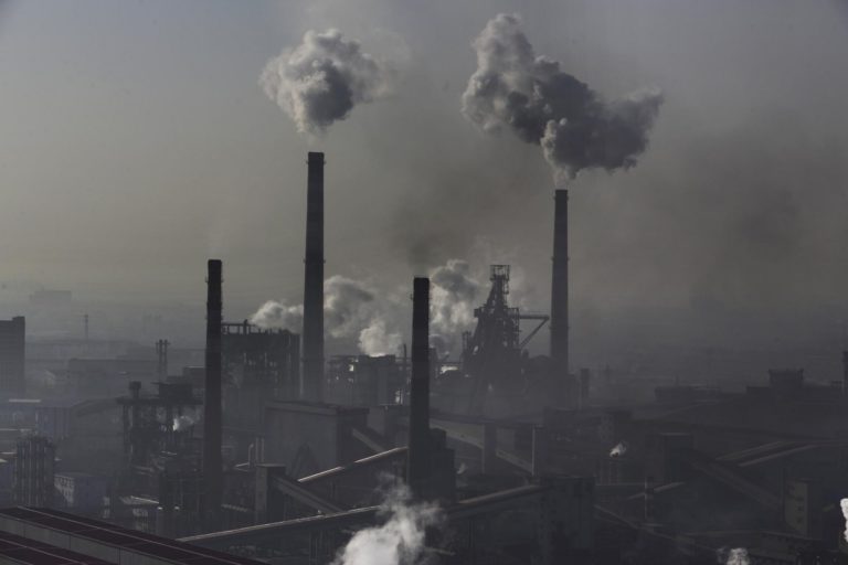 In Hebei province, smoke billows from chimneys from the steel plants in 2014. Photo © Lu Guang / Greenpeace