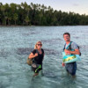 Jayna DeVore and Simon Ducatez approaching Hiraanae motu.