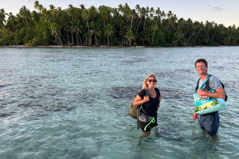 Jayna DeVore and Simon Ducatez approaching Hiraanae motu.