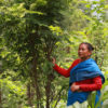 A member of the Bhimeshwori Sustainable Farming Group at her agroforestry farm in Kavre, Nepal. Image by Abhaya Raj Josh / Mongabay.