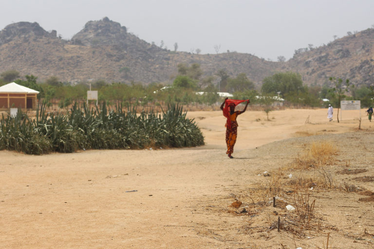 A refugee from Nigeria walks in the Minawao refugee camp.