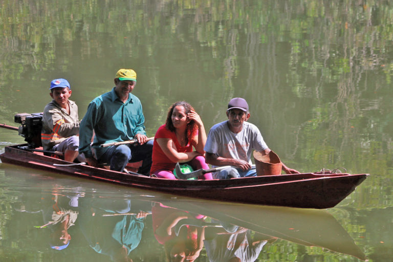 Members of the Quilombolas community make their way across.