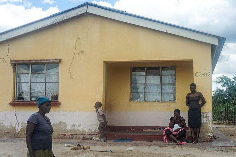 Alice Gama looks at cracks that have developed on the wall of her house in Arda Transau, an area near Zimbabwe’s Chiadzwa diamond fields. Image courtesy Linda Mujuru, GPJ Zimbabwe. Image courtesy of Evidence Chenjerai.
