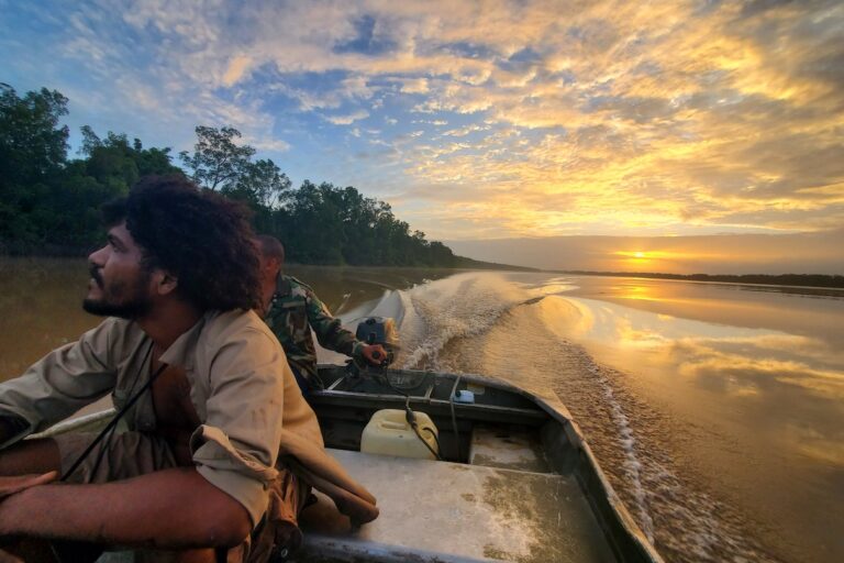 One Earth Conservation parrot conservationist Steve-o Oldenstam (left) monitoring parrots along a river in Suriname. Photo courtesy of LoraKim Joyner/One Earth Conservation.