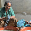 The Deekali Project: Women washing plastic waste to prepare for the grinding machine at a local recycling facility in Senegal.