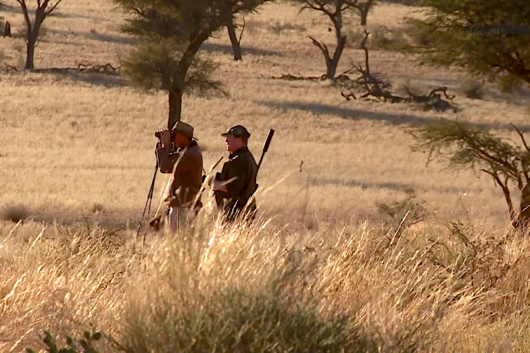 Professional hunter (left) with a hunting guest (right) in Namibia. Image by Mikael Tham via Wikidmedia Commons.