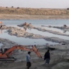 Unregulated gold mining on a river in, Nowshera, Pakistan. Image courtesy of Sabir Hussain.